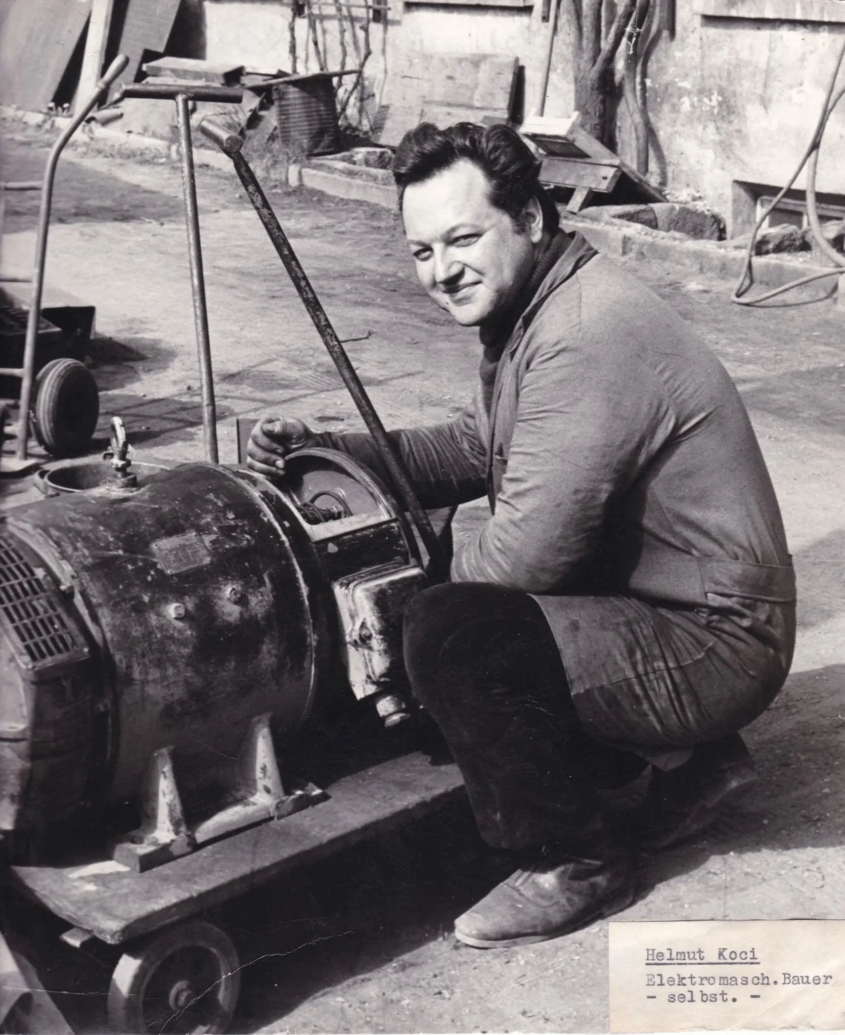 Historic workshop photograph with a technician