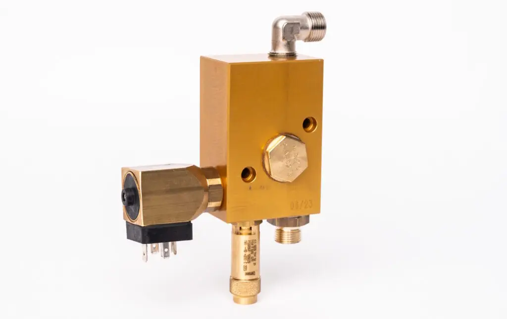Brass control block for a compressor
