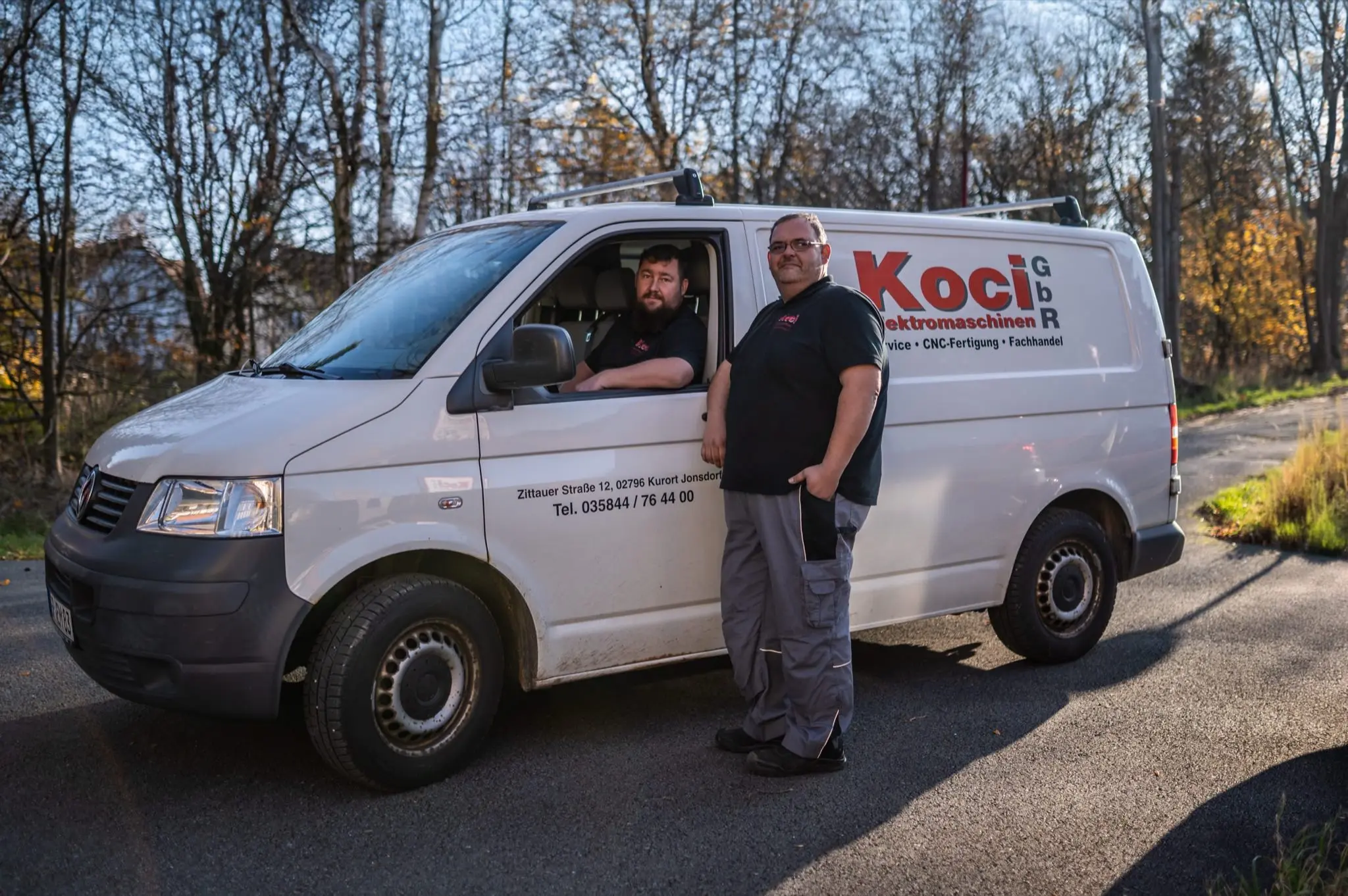 KOCI service team beside their service van
