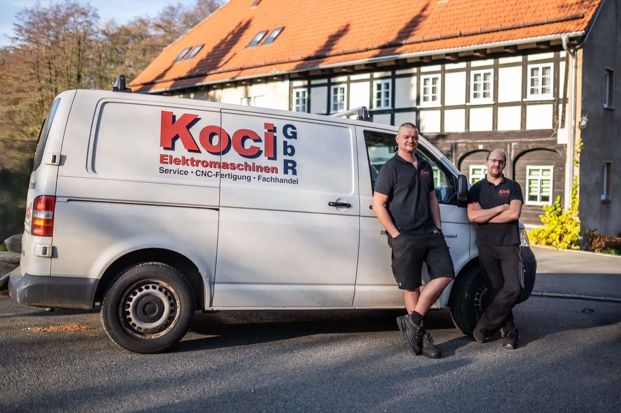 KOCI workshop team beside a service vehicle
